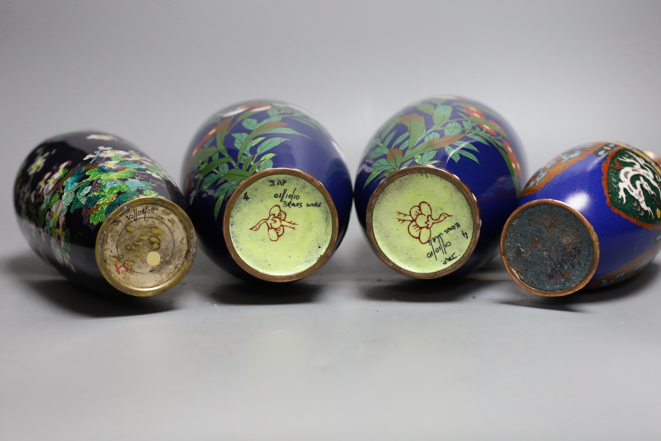 A group of Japanese cloisonné enamel wares to include a pair of vases, two other vases and a dish, Meiji period